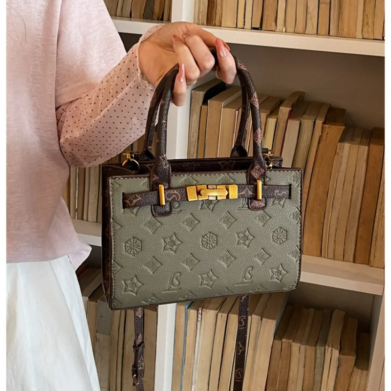 Classic embossed pattern handheld crossbody bag with moderate layered interior, fits cosmetics, cards and other daily small esse