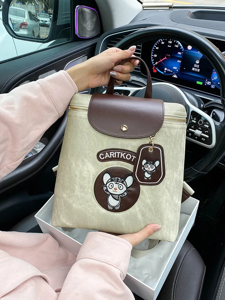 

Vintage and Luxury School Bag with Cute Cartoon Embroidery and Fashion Contrast Color 2026 Women New Trendy Backpack for Travel
