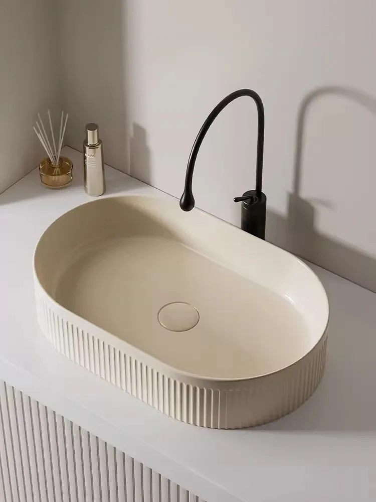 

A basin of ceramic household washbasin on the cream wind platform single basin of balcony, rectangular washbasin, and sma