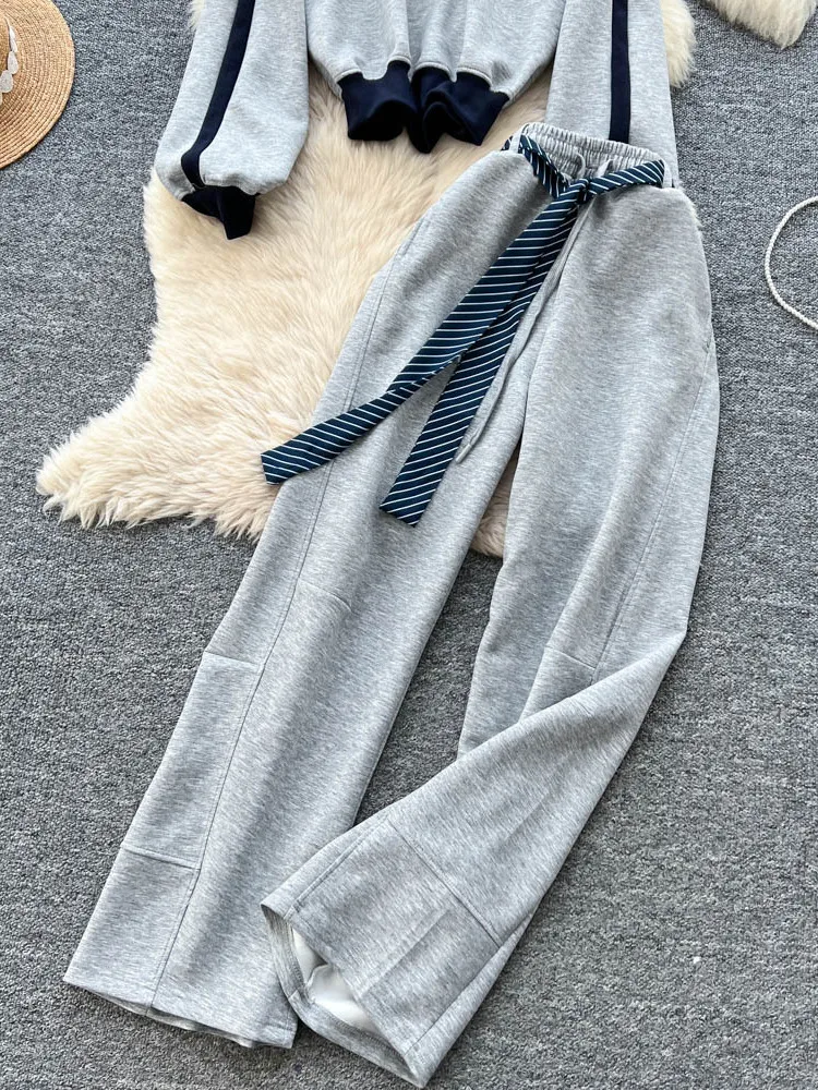 ชุดเซ็ตเสื้อฮู้ดแขนยาวสไตล์เรโทรอเมริกันสีตัดกัน กางเกงขายาวเอวสูงทรงขากว้างสำหรับผู้หญิง ชุดลำลองแฟชั่น