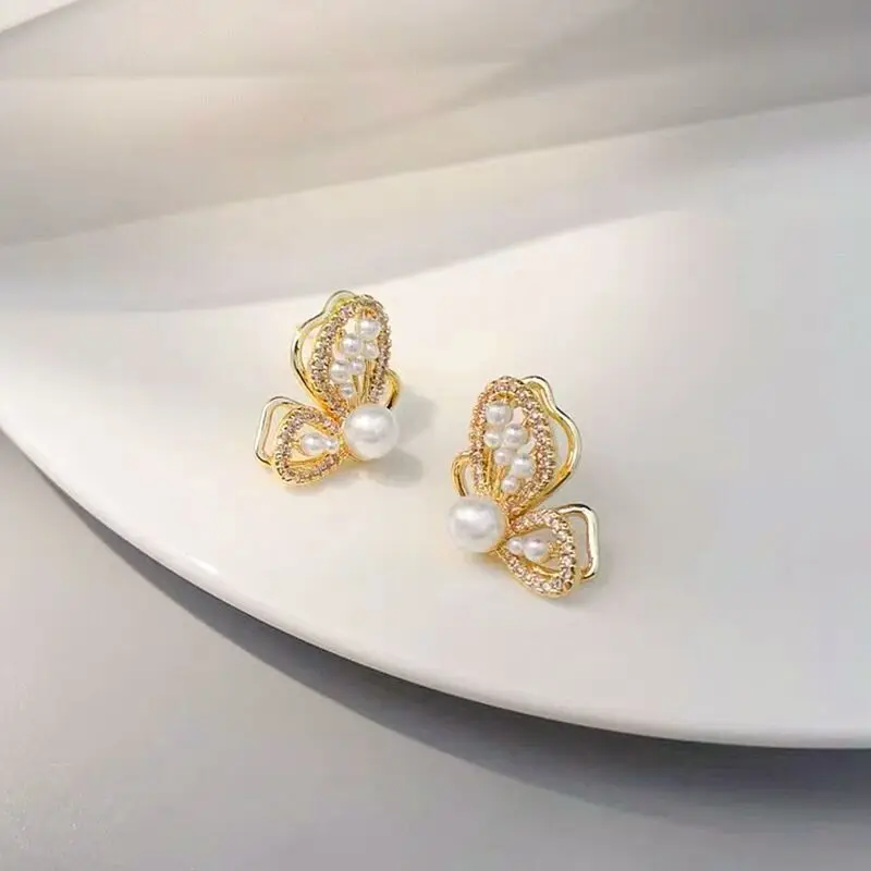 Pendientes dorados de mariposa con personalidad para mujer, aretes brillantes con incrustaciones de perlas de imitación, diamantes de imitación,