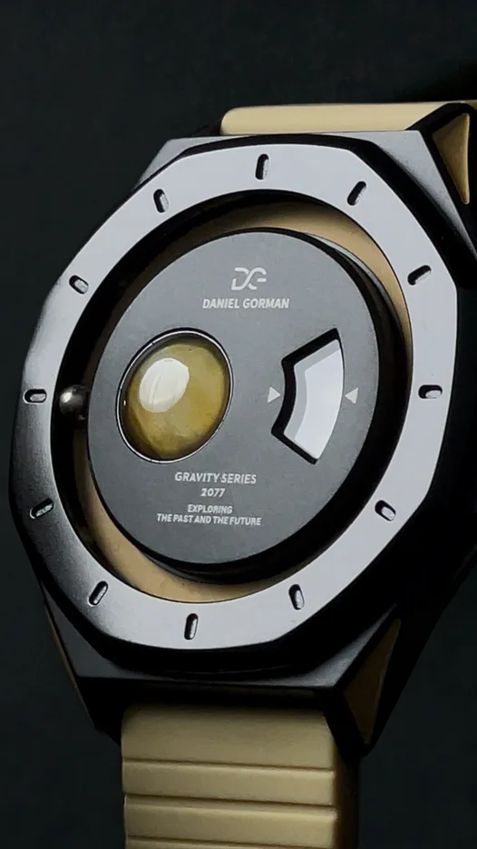 

Daniel Gorman Magnetic Ball Watch Sci-Fi Design Rotating Disc Time Display Space Exploration Concept Unique Men's Wristwatch
