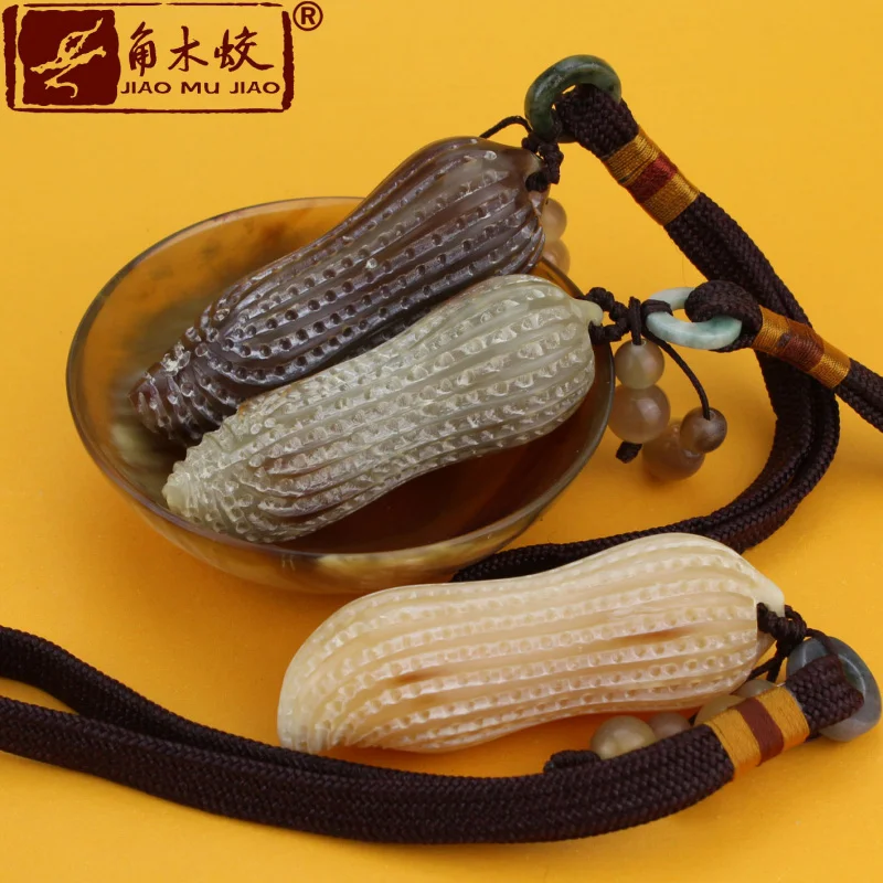 Carved pieces of hornwood and white yak horn with realistic designs