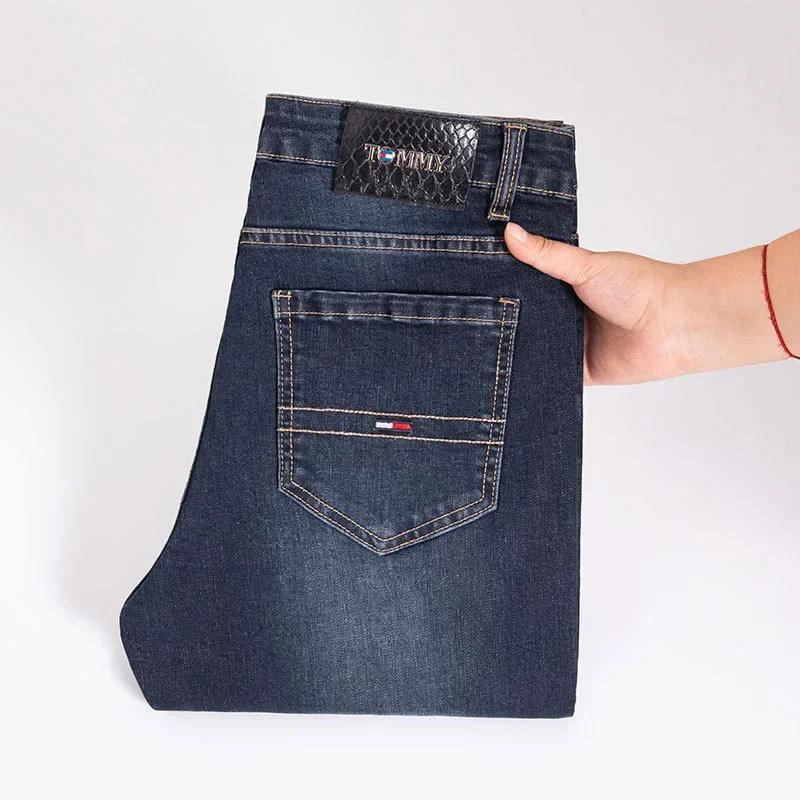 جينز رجالي من Tommu Overstock عالي الجودة على الطراز الأوروبي أزرق عميق للربيع والخريف بقصة ضيقة ينعم صورتك المستقيمة الساق