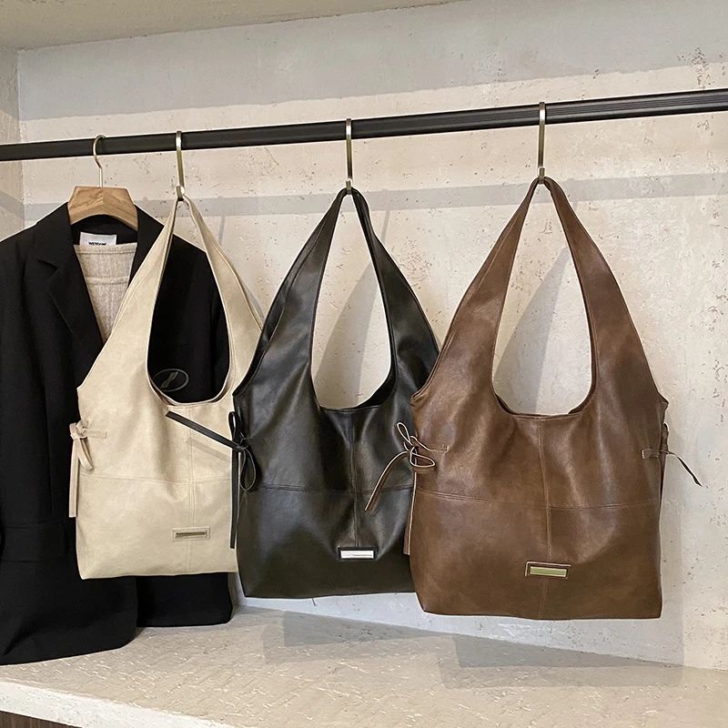 2025 Autunno/Inverno Tote casual di grande capacità Borse a tracolla in tinta unita con cerniera in PU Borse da viaggio quotidiane durevoli impermeabili