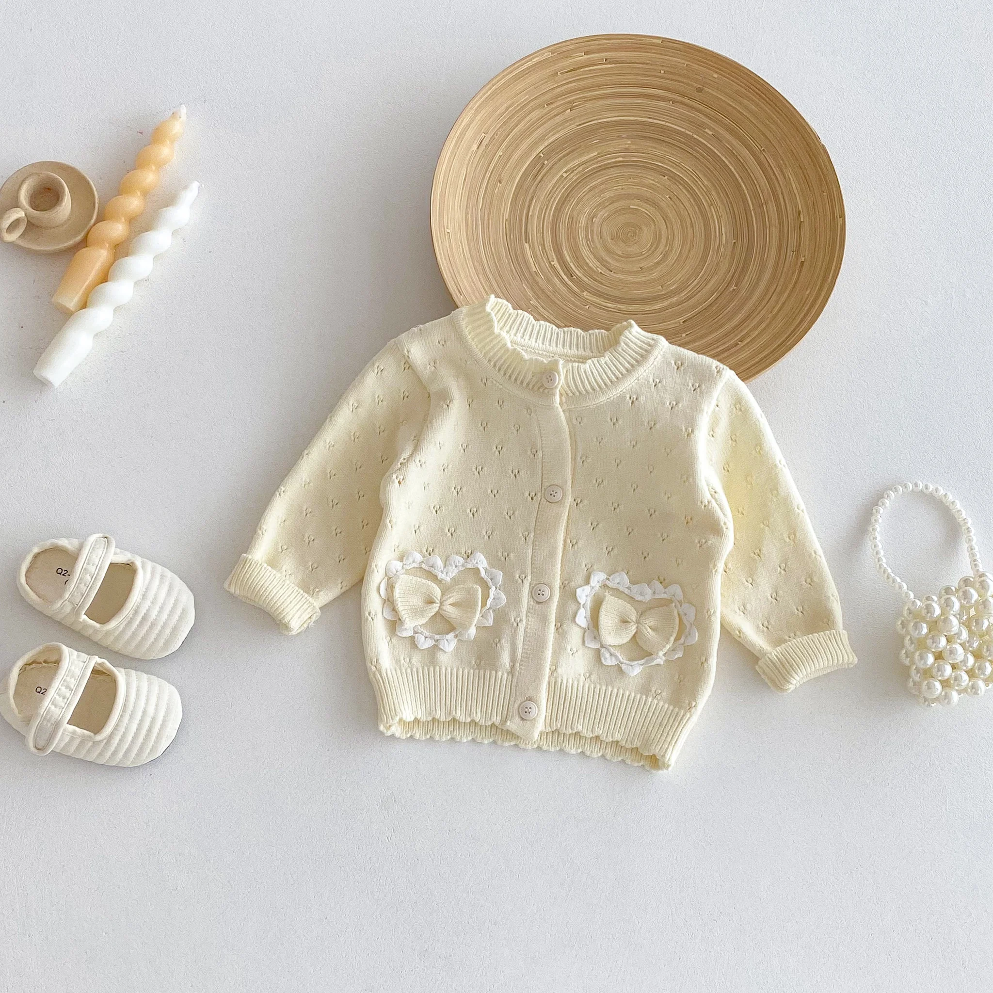 A Long-Sleeved Cardigan with a Bow and a Hollowed-Out Small Coat for Girls in Autumn and Winter