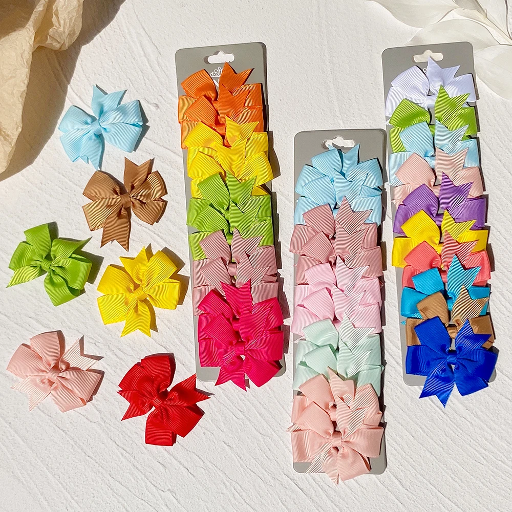 10 pz/lotto simpatici fiocchi per capelli in tinta unita con clip per bambini ragazze fermagli per capelli con nastro in Grosgrain mollette accessori per capelli copricapo