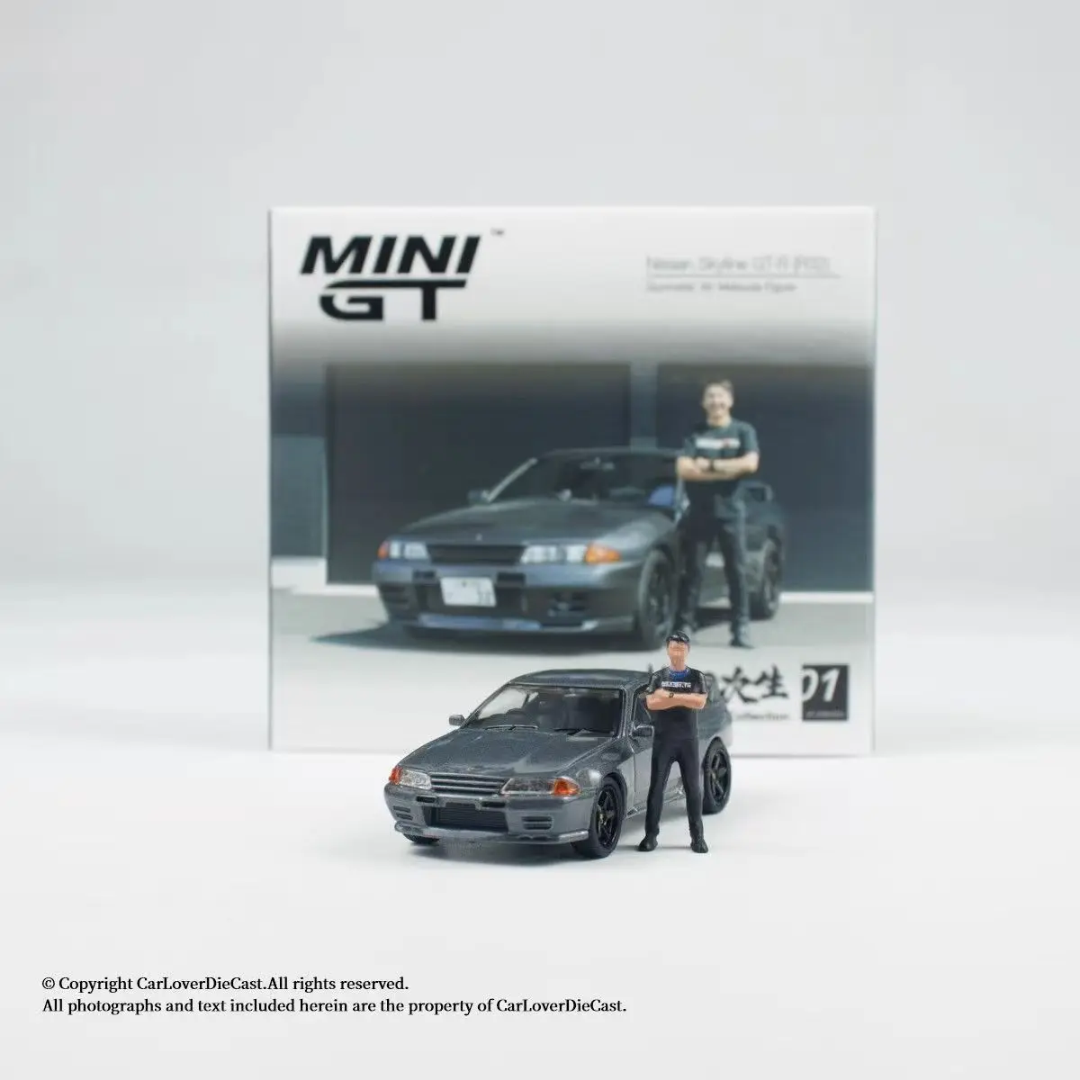 MINIGT #869 1/64 Nissan Skyline GTR R32 Gunmetal W/Tsugio Matsuda