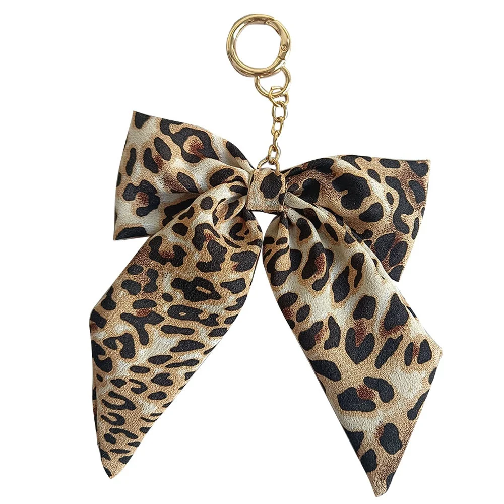 الكورية ليوبارد حقيبة معلقة الشريط القوس المفاتيح المنظم مفاتيح السيارة حامل مع شرابة مكافحة فقدان حقيبة سحر للنساء الفتيات