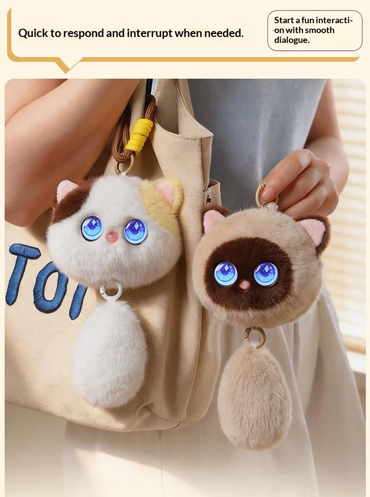 Small plush cat toy shown in a hand for scale