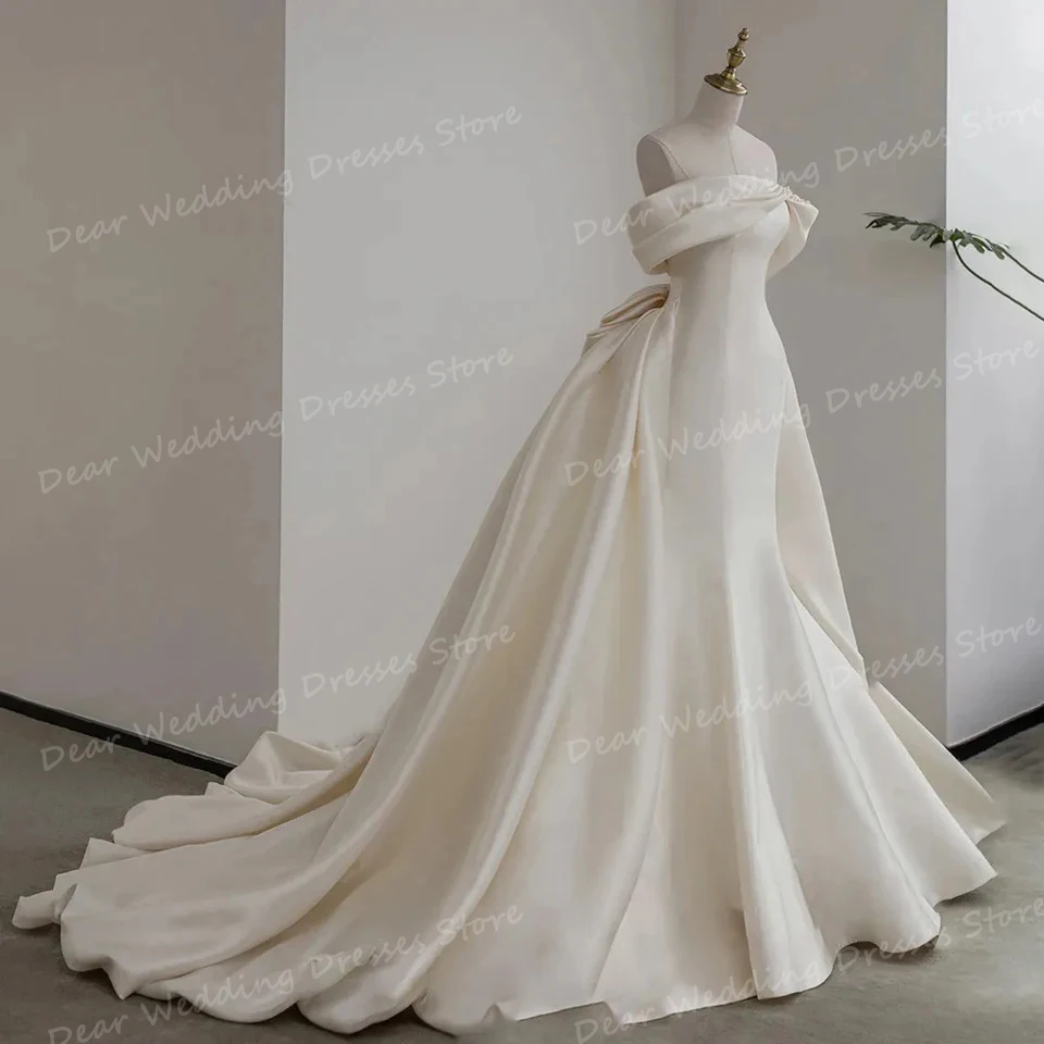 Squisiti abiti da sposa in raso A pieghe da donna una linea Sexy con spalle scoperte fiocco senza schienale per abiti da ballo da sposa Sweep Train Formal