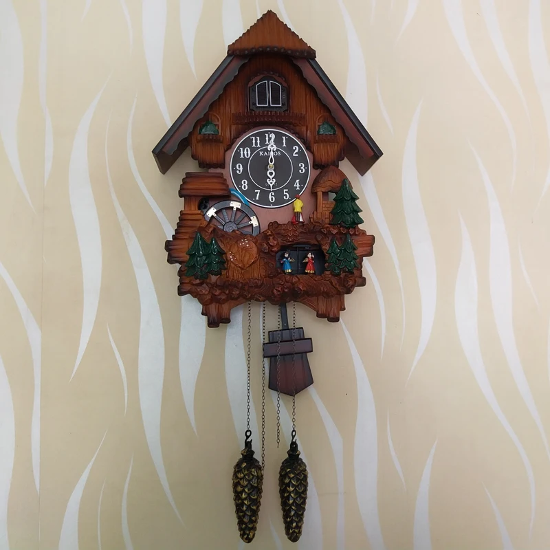European cuckoo wall clock cooing and telling the time, light control on the hour, telling the time in living room, children