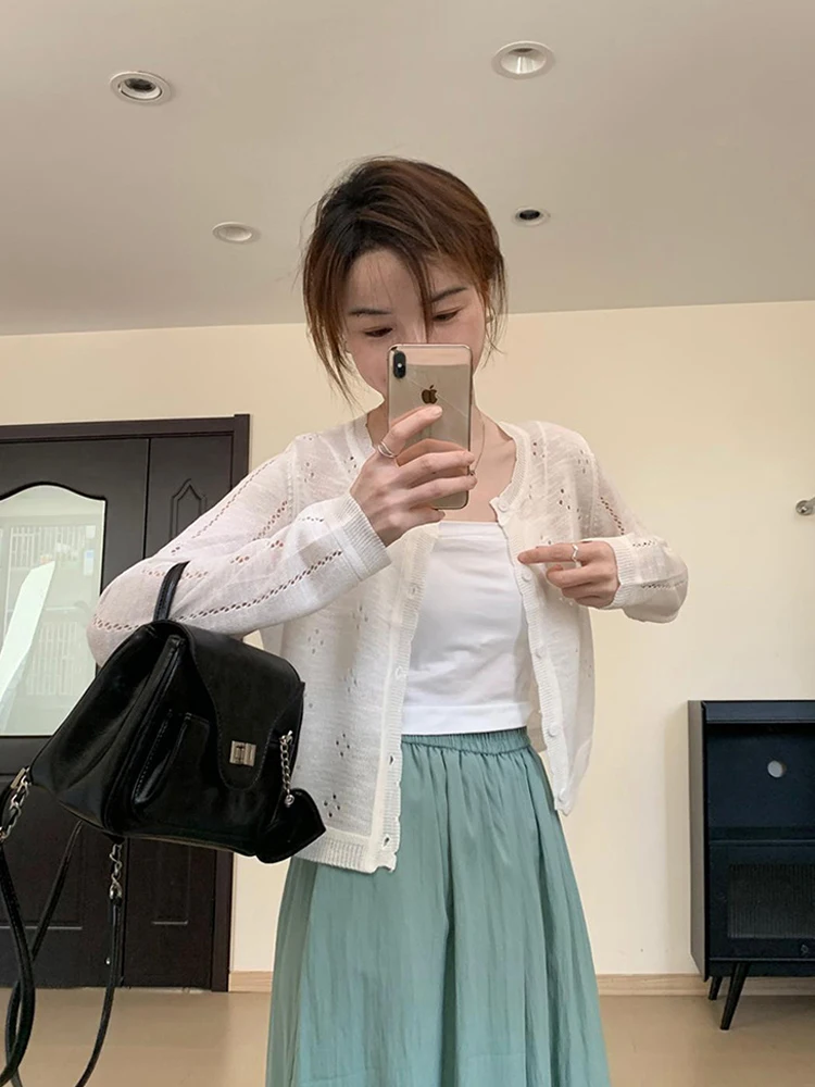 เสื้อคาร์ดิแกนถักแบบโปร่งสไตล์ฝรั่งเศส แขนยาว คอกลม ทรงหลวม แฟชั่นเรียบง่าย สไตล์ลำลอง สำหรับผู้หญิง ใส่แล้วดูผอมเพรียว เหมาะสำหรับฤดูใบไม้ร่วง