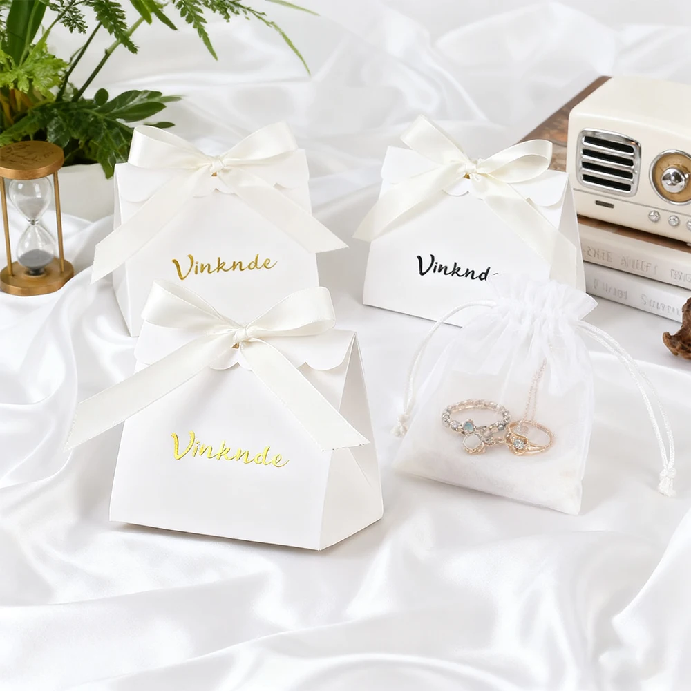 

Customized Luxury Bow Ribbon Handle White Black Kraft Paper Shopping Bags Boutique Jewelry Cosmetic Candy Packaging Box Pouches