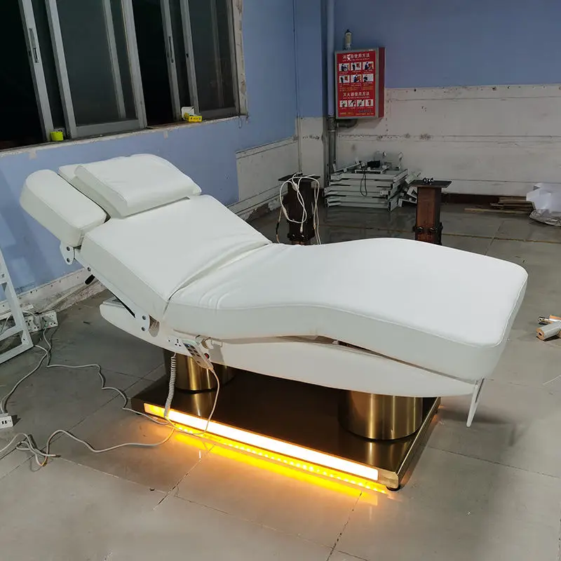 Electric Massage Bed With Metal Frame And Buff Upholstery For Professional Beauty Salon Spa Use