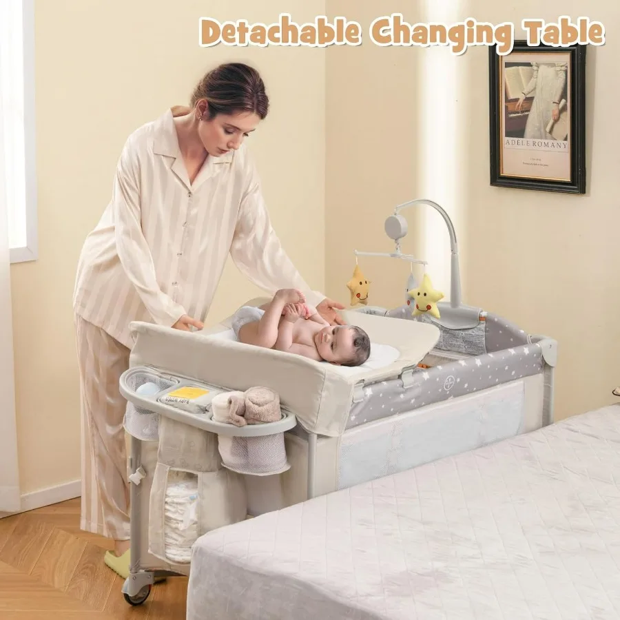 Pack and Play with Bassinet 5in1 Baby Bedside Sleeper w Diaper Changing Table Storage Bag Toy Arch Music Box Detachable Side Ra