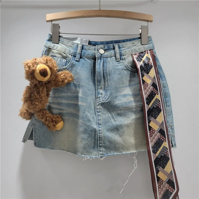 

Playful Cartoon Print Denim Skort. This US vintage wash skirt with a raw hem offers a unique, versatile coquette style.