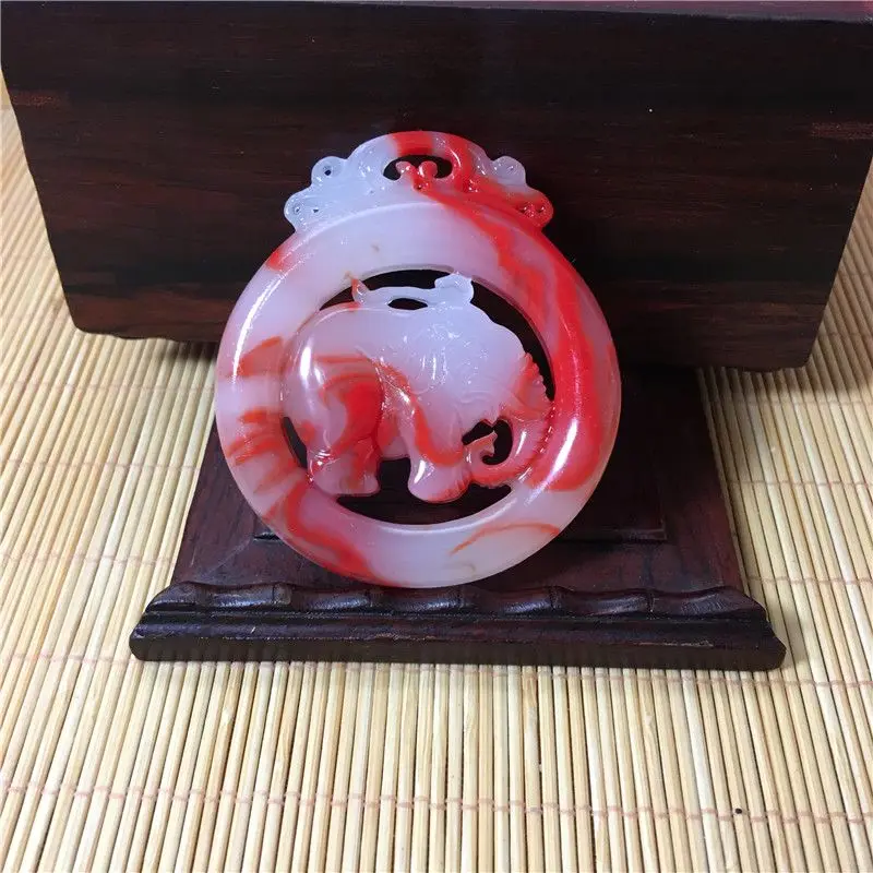 

Chicken blood floating colorful jade auspicious pendant elephant hollow jade card