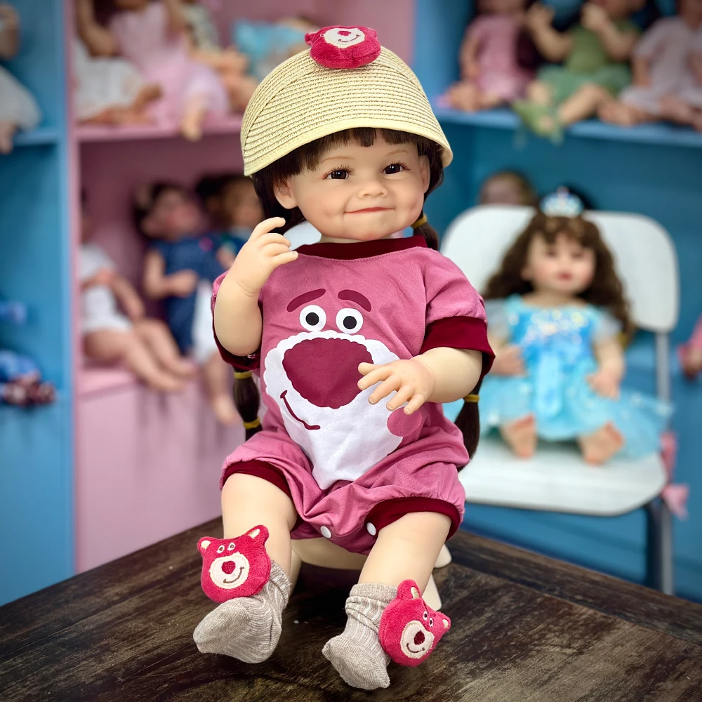 

22 inch Reborn Doll, Rare Edition, Cute Smiling Expression, Brown Long Hair (Braids), Pink Cartoon Clothes, Poseable,