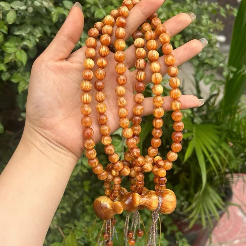 Natural fully translucent amber 10mmx36 bracelet, Northeast pine beads, high oil content raw wood