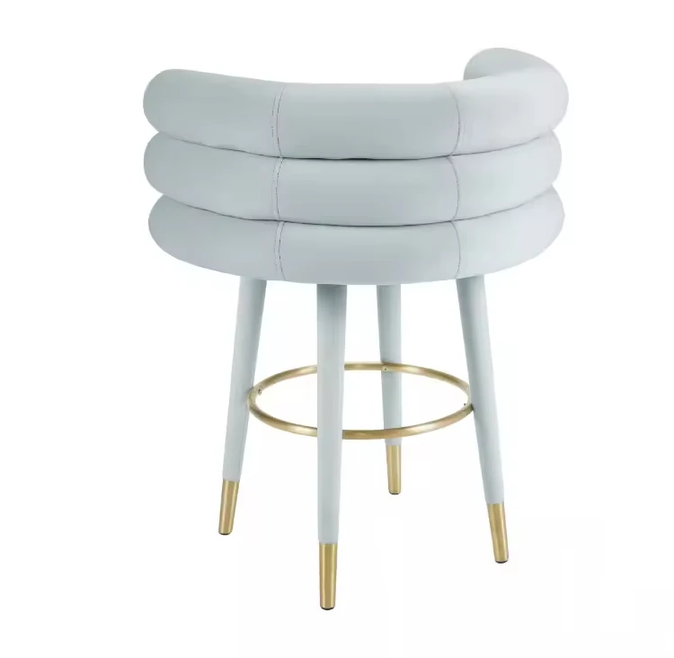 Light blue velvet bar stool with gold metal hoop footstool for a comfortable tufted back