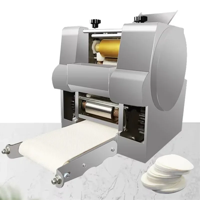 آلة صنع عجينة السمبوسك الصغيرة على سطح الطاولة / آلة صنع غلاف التورتيلا روتي