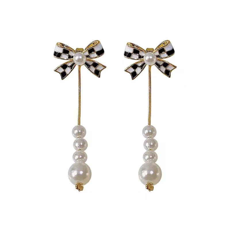 Duodaanza-Boucles d'oreilles à pampilles en perles noires et blanches pour femmes, nœud papillon assressenti, bijoux de fête à la mode, accessoires indépendants, 2023