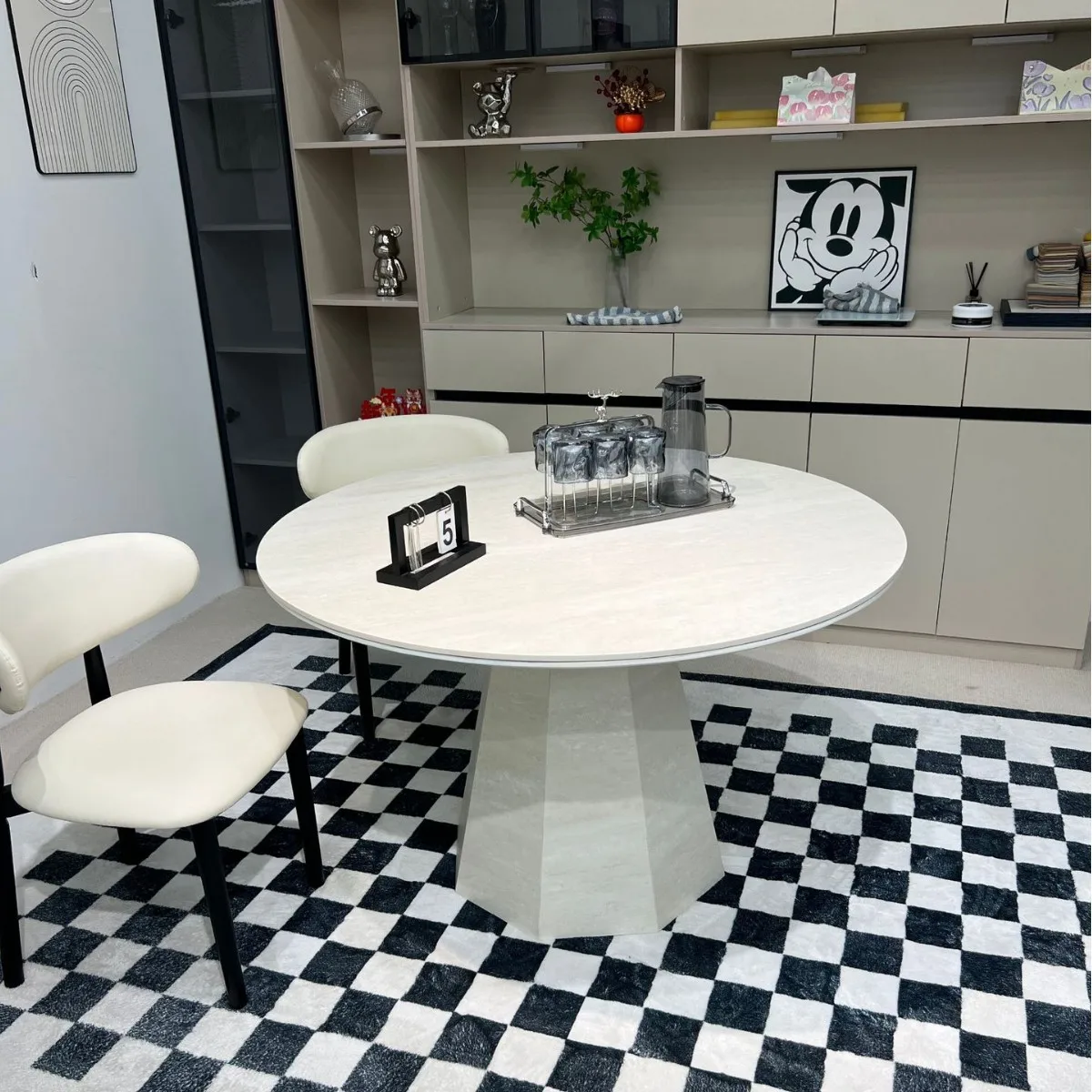 The new travertine rock slab dining table is simple, modern, high-end medieval and quiet wind small apartment round dining table
