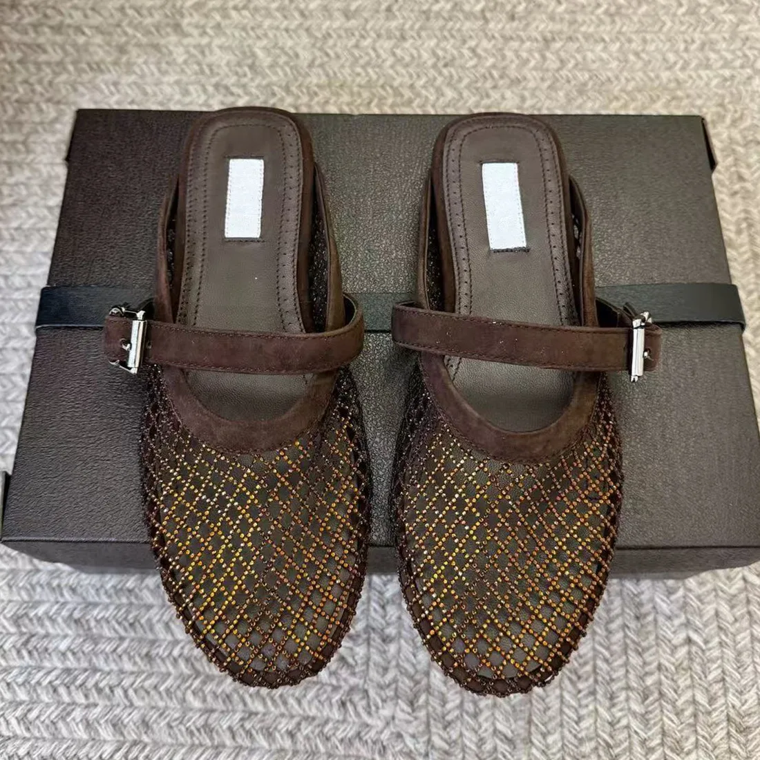 

Knitted hollow toe half slippers for women's summer outdoor wear 2026 new French flat bottomed silver lazy sandals