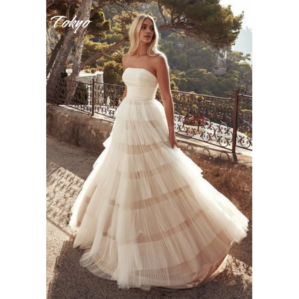 Abito da sposa bianco senza spalline personalizzato Tokyo Abiti da sposa senza maniche con volant a cascata 2025 Abiti da sposa con strascico a-line