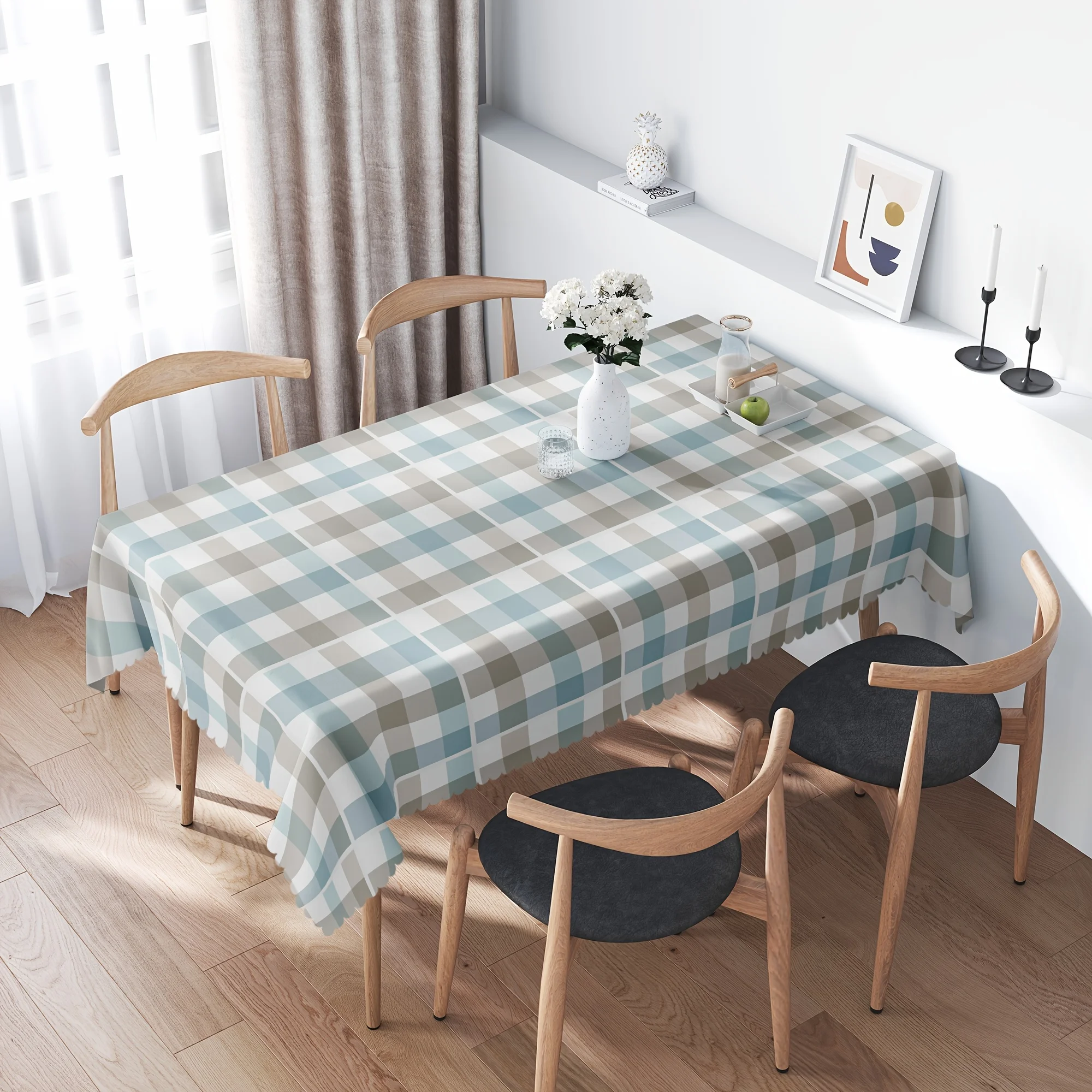 One white, gray and blue checkered tablecloth is replaced by a wrinkle-resistant checkered tablecloth.