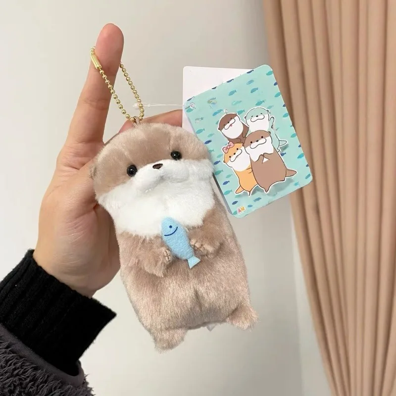 

Japanese 10CM kawaii Sea Otter Plush Toy Keychain cute Stuffed Animals Little Otter doll Fish Hugging Sea Otter Straw Hat TOY