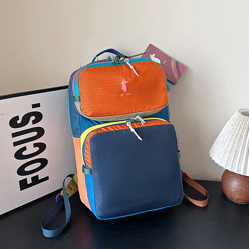 

Outdoor travel fashion splicing color collision ultra light dopamine large capacity computer backpack