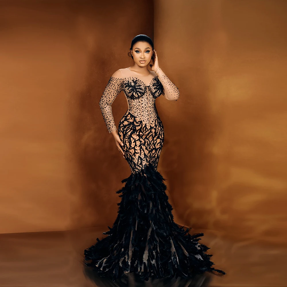 

Black Feather Mermaid Evening Gowns Nude Color Beaded Long Sleeves Prom Dresses African Women Formal Occasion Party Dress Robe