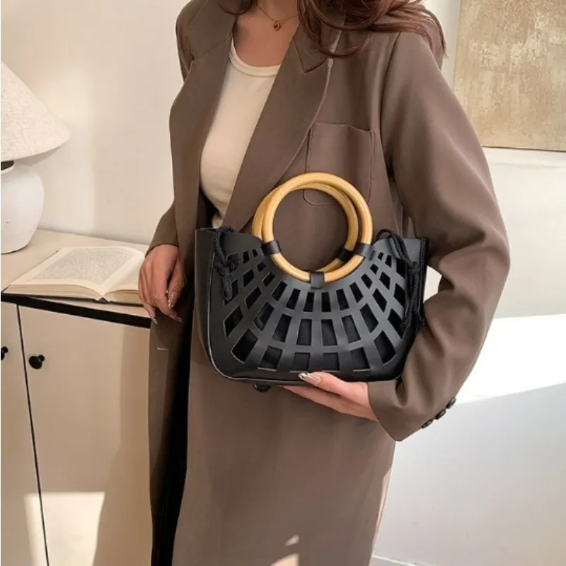 

New Versatile Fashion Simple Hand-held Crossbody Bag Retro Circular Hollowed-out Mother Child Bags Bucket Package Spring Summer