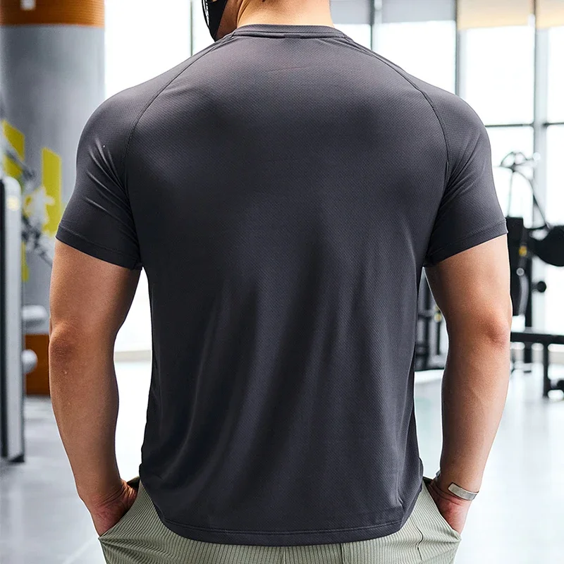 T-shirt de sport à manches courtes pour homme, haut de compression, sweat-shirt serré, chemises élastiques de fitness, coupe sèche, course à pied, protection contre les éruptions cutanées