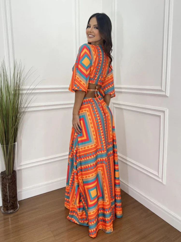 2025 Abito lungo elegante e sexy delle nuove donne di moda estiva 2025, scollo a V, temperamento stampato, abito lungo a mezza manica con blocco colore