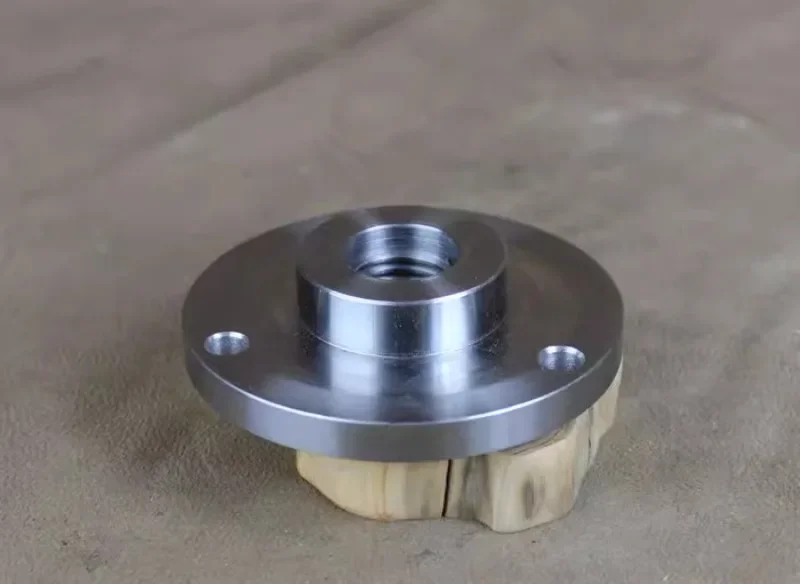 Adapting flange plate for metalworking lathe chuck used in woodworking lathes