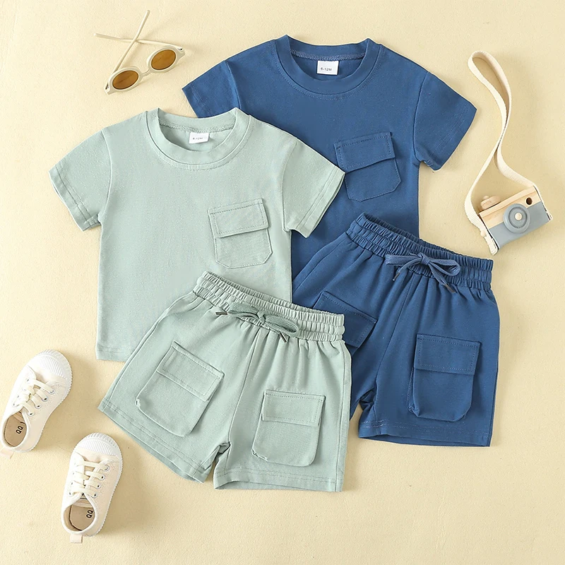 

2024-02-02 Lioraitiin Toddler Baby Boys Outfits Solid Color Pocket Short Sleeve T-Shirts Tops Elastic Waist Shorts Clothes Set