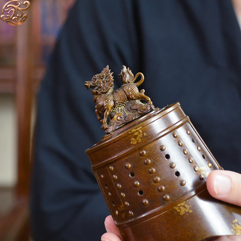 Gold-sprinkled, patinated Qilin offering auspicious blessings, a copper incense burner for office or tea room decoration
