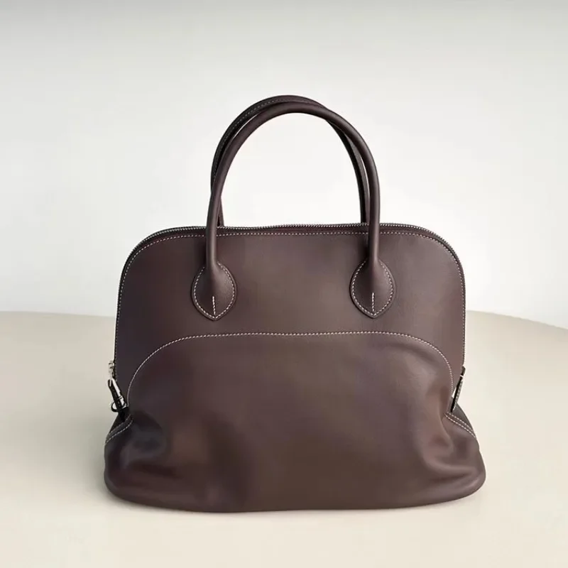 

Light Luxury Premium Sense Niche First Layer Cowhide Bowling Ball Large Capacity Portable Fashion Shell Bag Commuting Versatile