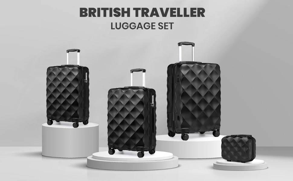 British Traveller luggage set featuring four black quilted suitcases of varying sizes displayed on white pedestals against a gray background.