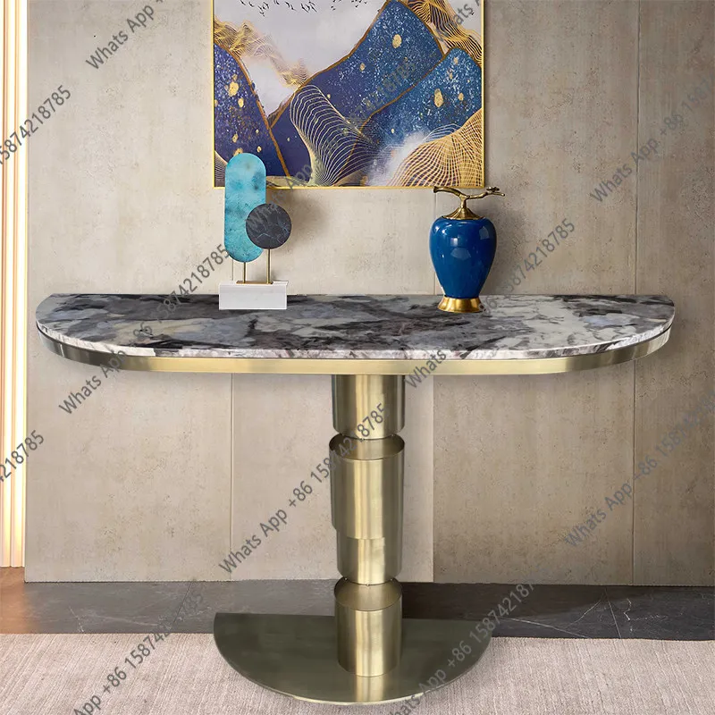 Entering the door, facing the door, rock slab porch table, light luxury against the wall, luxury atmospheric stainless steel