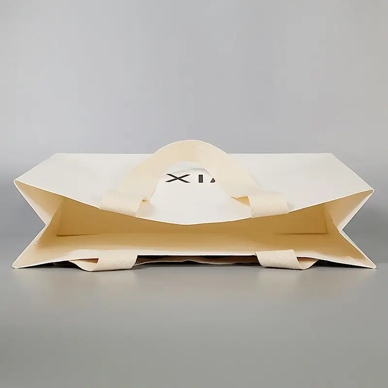 High-end Custom Logo White Cardboard Handbags Thickened Luxury Shopping Gift Bags for Clothing Store Retail Packaging