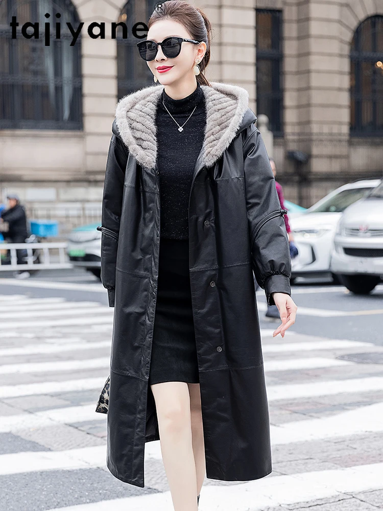 TAJIYANE 100% جلد البقر أوزة أسفل معطف طويل الجلد الحقيقي سترة منفوخة المرأة مع قبعة من المينك الشتاء ملابس خارجية ملابس امرأة 2025