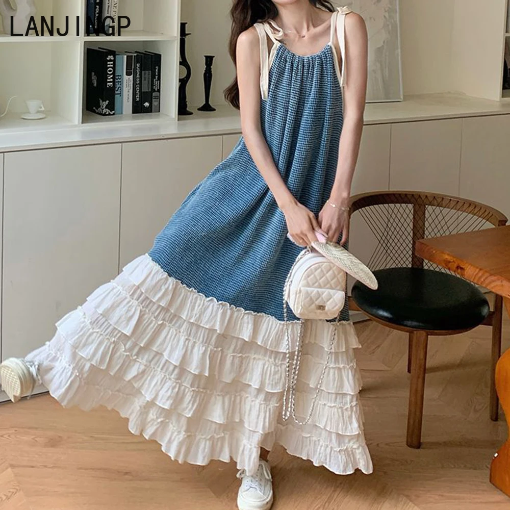 

Blue Ocean retro irregular temperament summer new suspender splicing dress design thin fringed long dress