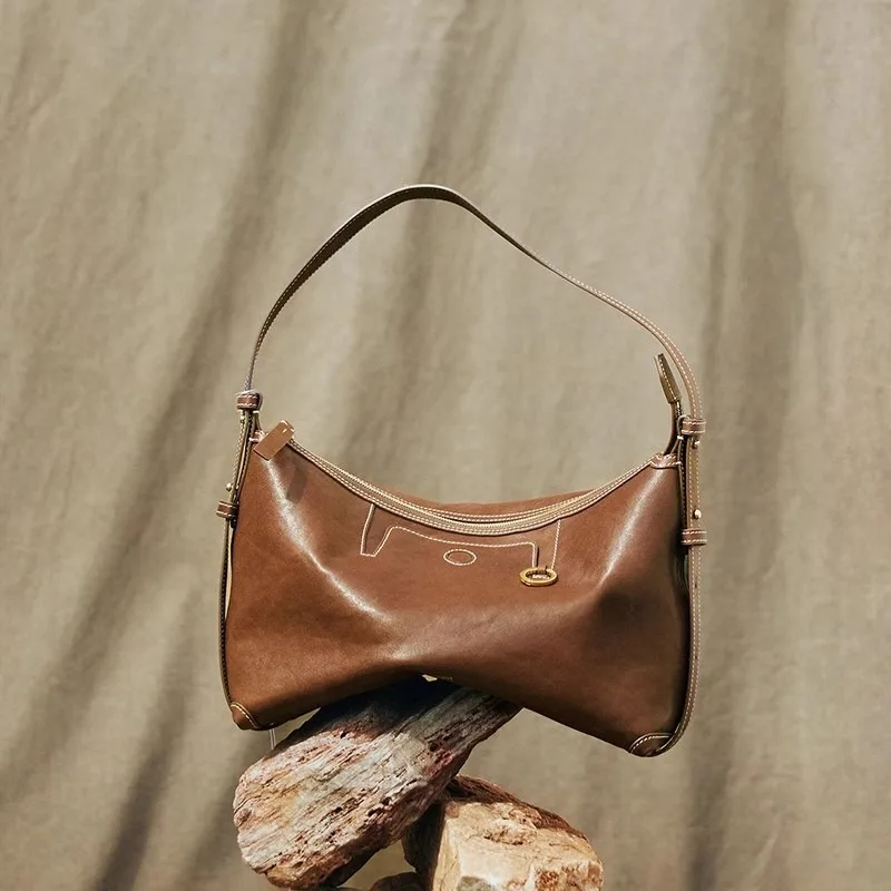 

New personalized and fashionable hobo bag, tanned cowhide, commuting armpit bag, dumpling bag, women's suede leather bag