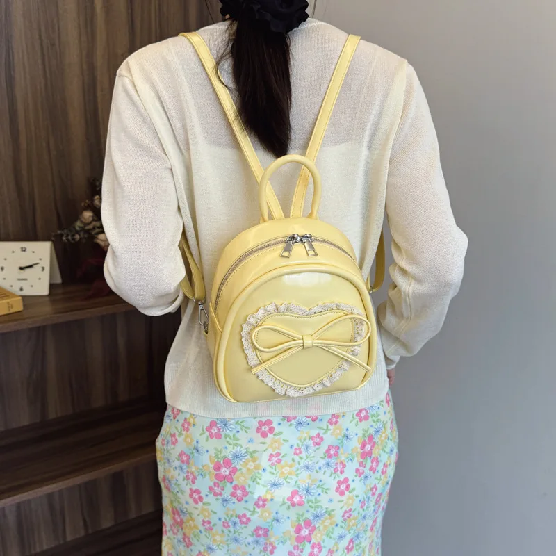

Cute and Sweet Ballet Heart Bow Backpack for Women 2026 New Fashion Versatile Lace Backpack College Style Handbag
