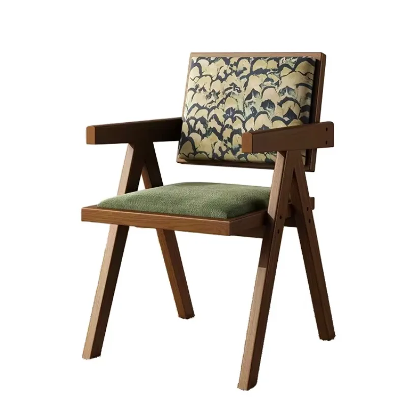 

Modern wooden armchairs with patterned backrests and green upholstered seats for restaurants, offices, and cafes