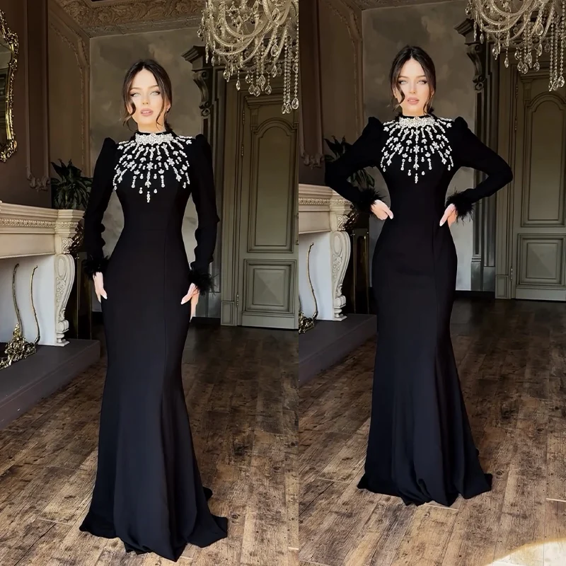 

Elegant Black Hand-Sewn Feather Long Sleeve Gown with Crystal Embellishments Fashionable Wrap Dress for Formal Occasions